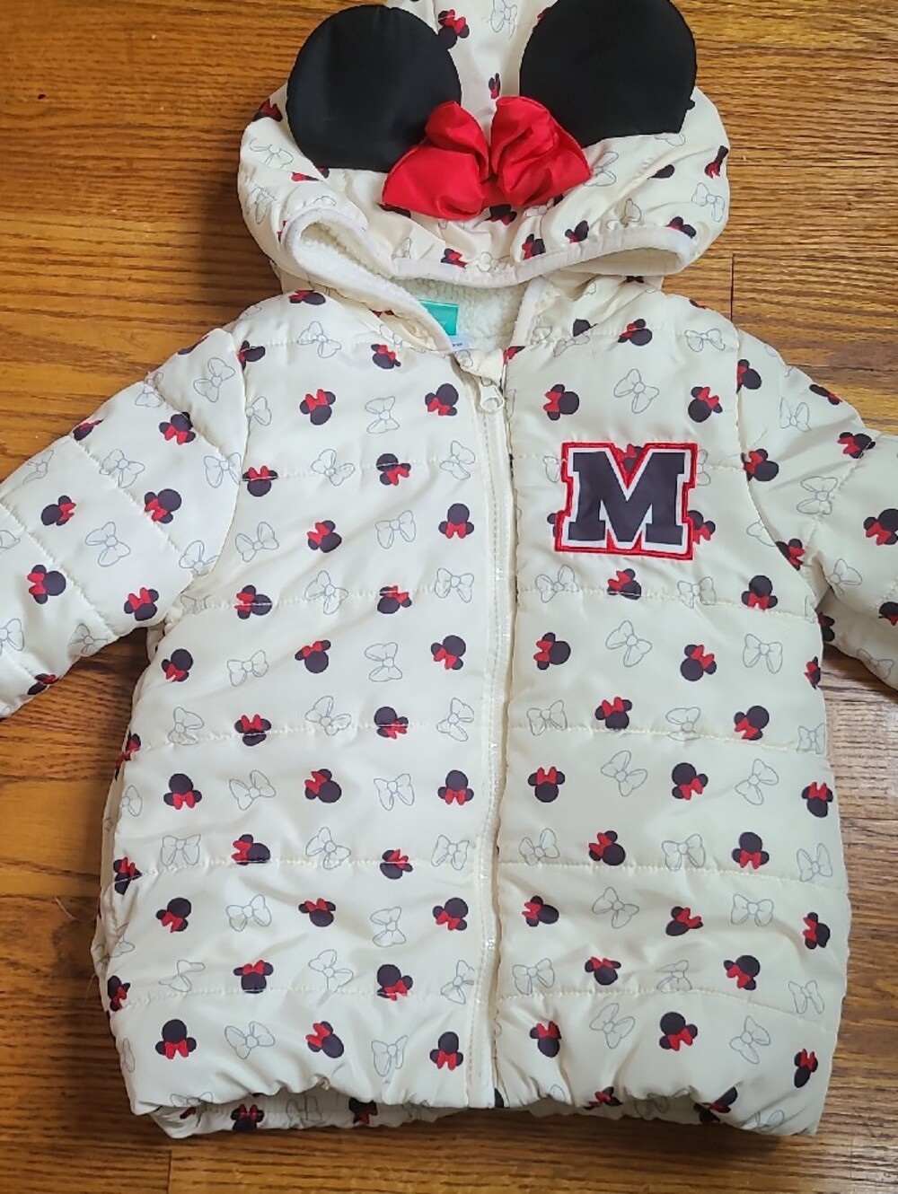Disney Cream Puffer Jacket with Red Bow Accents